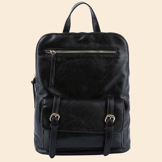 Black leather backpack with front zipper and buckle pocket on a beige background.