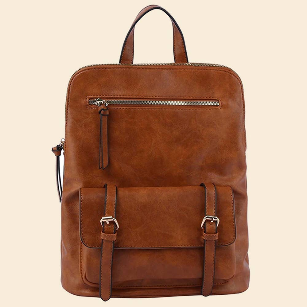 Brown leather backpack with front zipper and buckle pocket on a beige background.