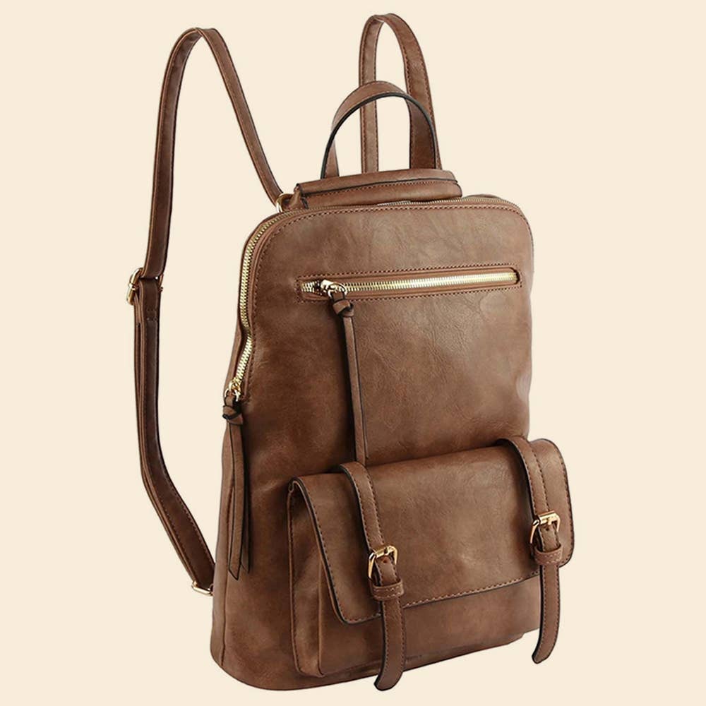 Brown leather backpack with long strap extended upward on a beige background.