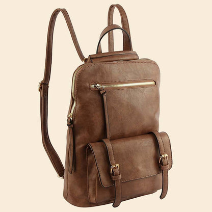 Brown leather backpack with long strap extended upward on a beige background.