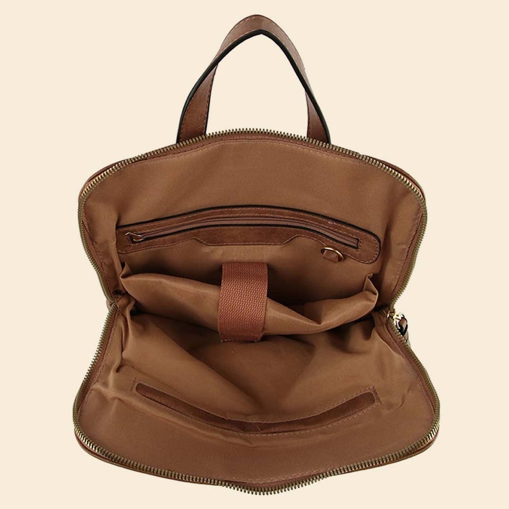 Open brown leather backpack showing interior compartments and zipper pocket on a beige background.