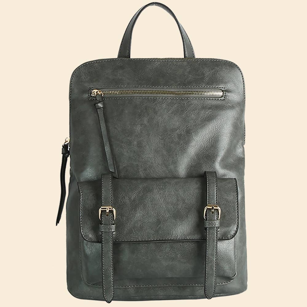 Dark gray leather backpack with front pocket, buckle straps, and zipper detail on a beige background.