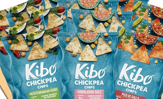 Kibo Chickpea Chips in Mediterranean Herbs, Himalayan Salt, and Pico de Gallo flavors with chickpeas, tomatoes, and lime on a blue background.