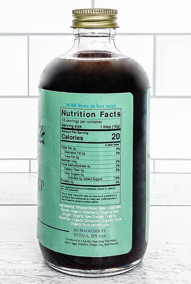 Sailor Mercy Elderberry Syrup nutrition label with ingredients and serving details. Small-batch, organic wellness syrup for natural immune support.
