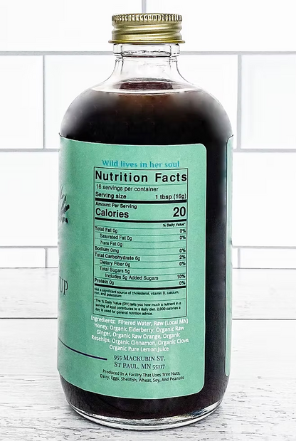 Sailor Mercy Elderberry Syrup nutrition label with ingredients and serving details. Small-batch, organic wellness syrup for natural immune support.