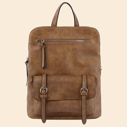Tan leather backpack with front zipper and buckle pocket on a beige background.