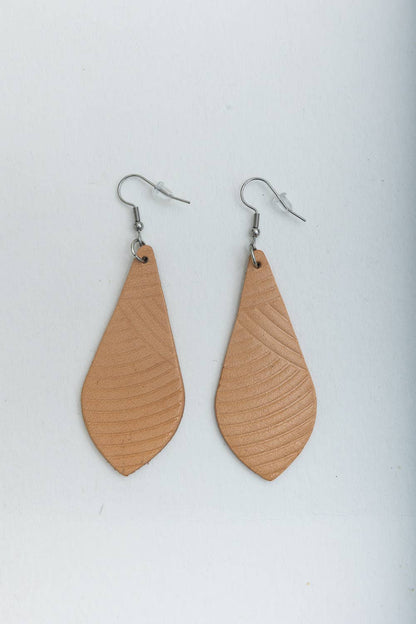 Pair of tan leather teardrop earrings on a white background.