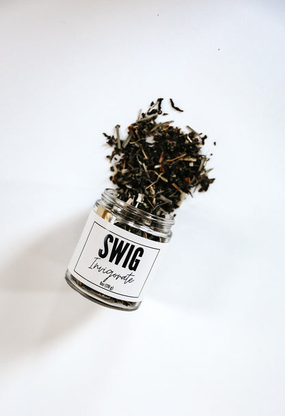 The Goodery Swig Invigorate loose leaf tea in a clear jar with black and white label against a white background.