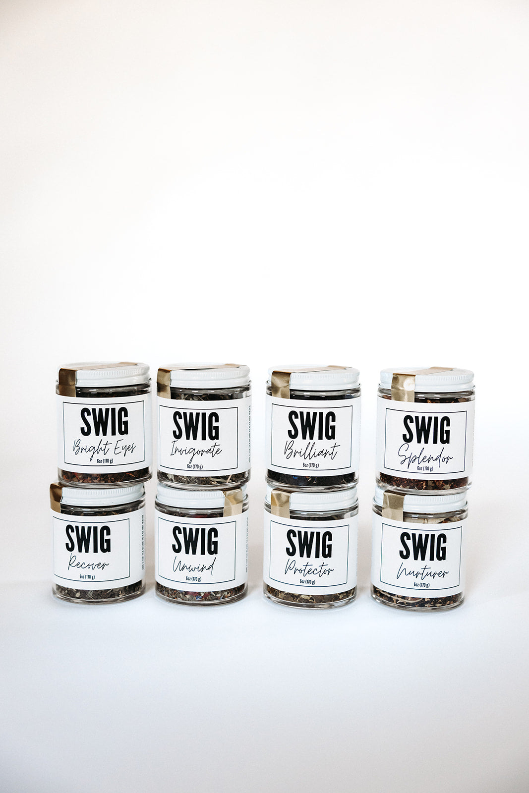Nine SWIG loose leaf tea jars stacked in three rows on a white background, showcasing The Goodery’s full tea collection.