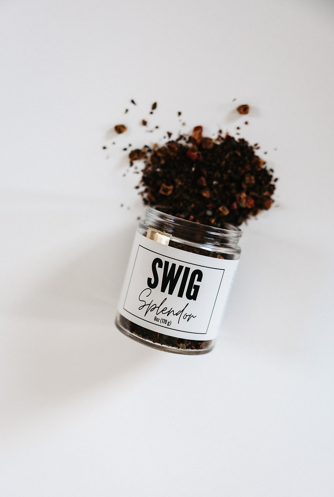 Swig Tea Splendor loose leaf blend spilling from tilted jar by The Goodery