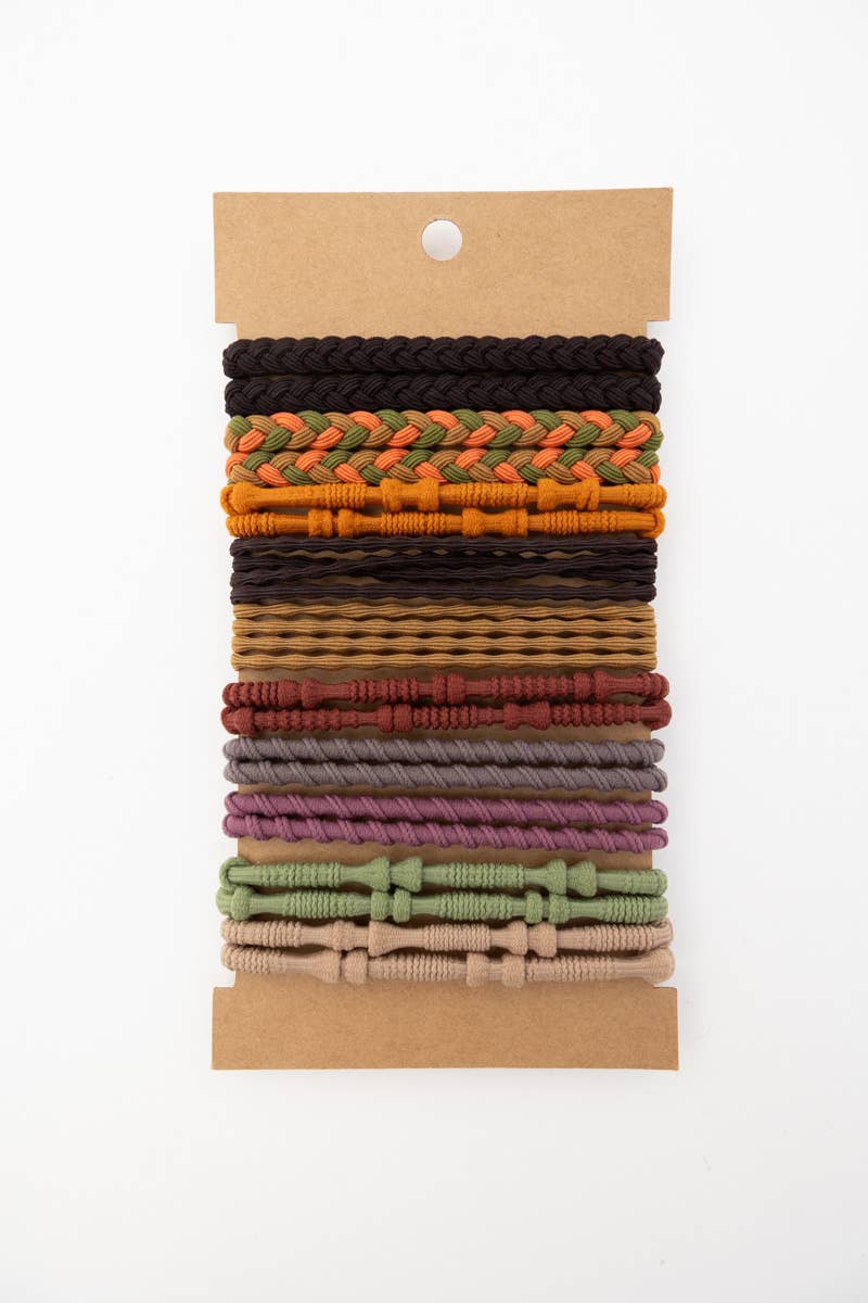 Multi-pack of braided and solid woven hair ties in fall-inspired colors on a white background