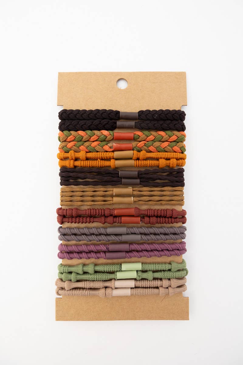 Set of colorful woven hair ties on a cardboard display card, assorted neutral and earthy tones